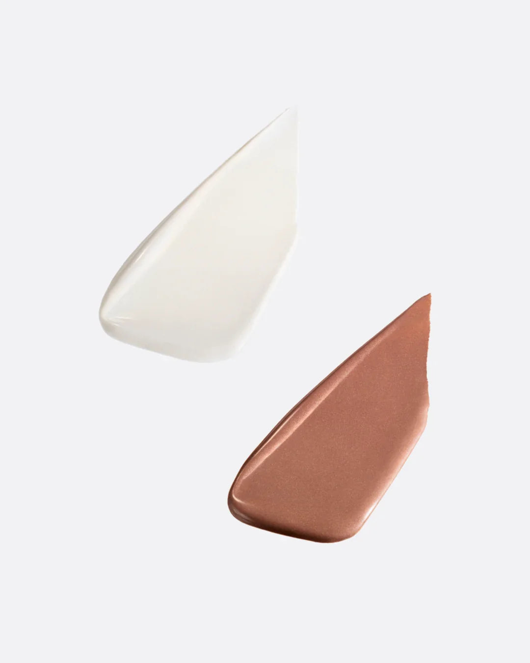 Close-up of a beige and brown highlighter lucid and deep from submission beauty on a light gray background