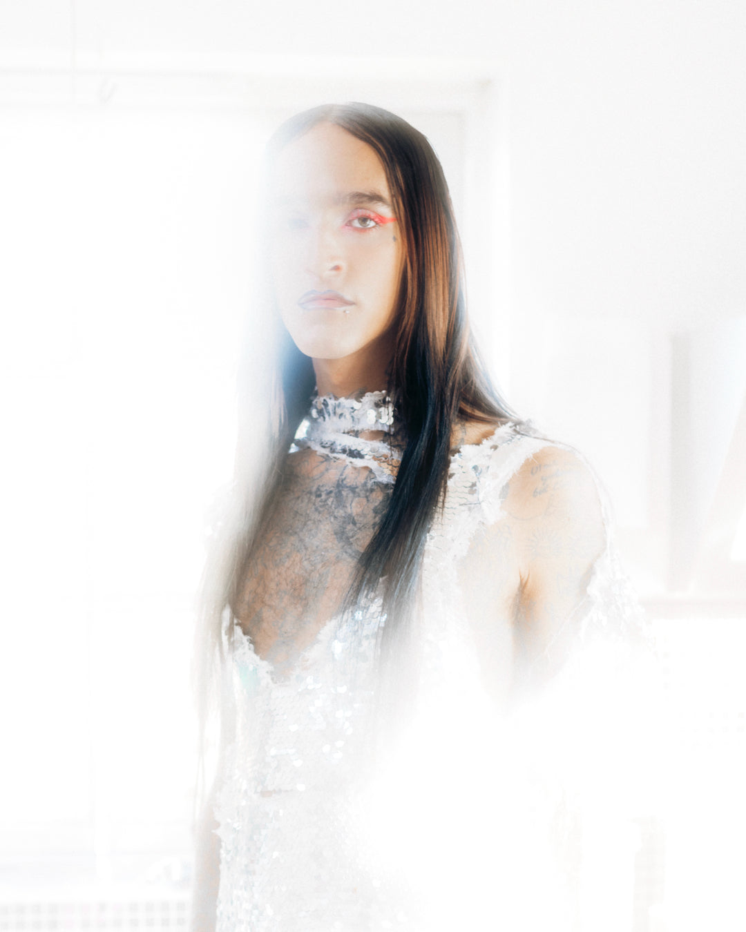 djg2g wearing a white lace dress with a blurred background