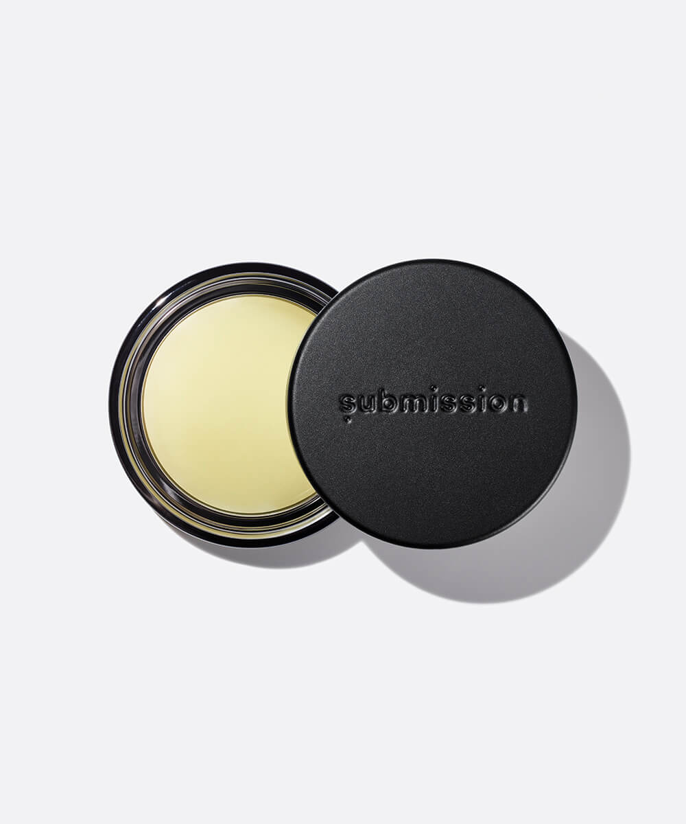 open container of Balm Shiny, a multifunctional plant-based balm intended for all skin types.