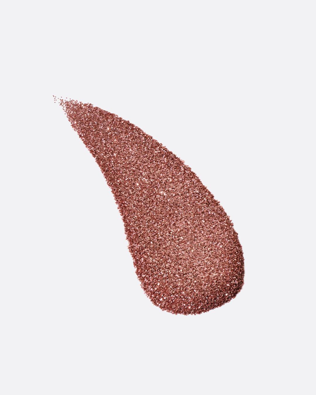  a stylized swipe of plastic-free plant-based biodegradable bronze glitter highlighting the glitter’s texture and varied shades of bronze