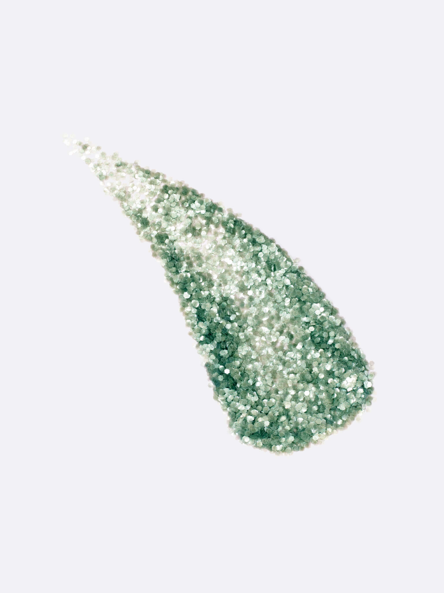 a stylized swipe of plastic-free plant-based biodegradable green glitter highlighting the glitter’s texture and varied shades of green